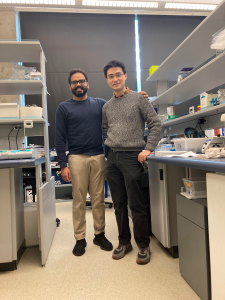 Dr. Udit Dalwadi stands in a lab with Dr. Calvin Yip